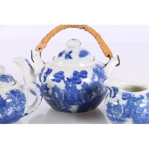 141 - Chinese style miniature blue and white toy china tea service in original box.