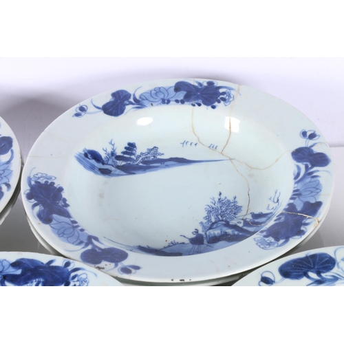 143 - Eight Chinese blue and white dishes decorated with pavilion scene, 23cm diameter.  (a/f)