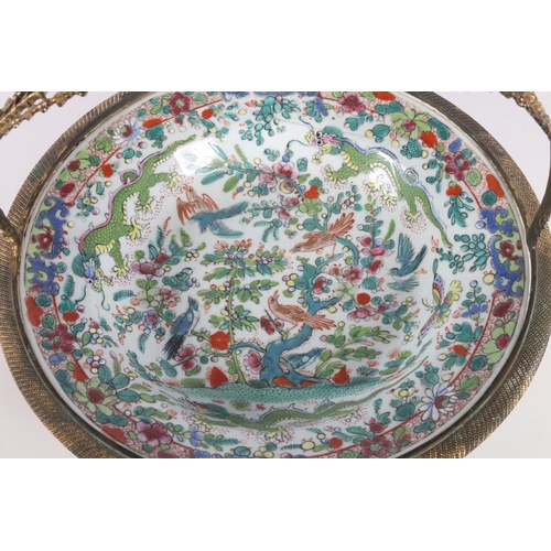 144 - Oriental famille rose porcelain dish with all-over decoration including dragons, insects and birds, ... 