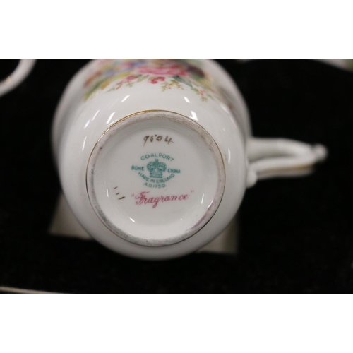 151 - Coalport Fragrance six place floral decorated coffee set, in fitted case.