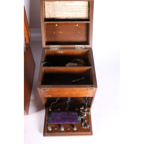 153 - Electro shock therapy machine, in original mahogany case, 31cm wide, and another.