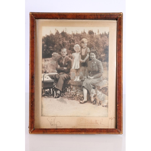 356 - Royalty interest, a framed photograph of Queen Elizabeth, Prince Philip and children, signed to the ... 