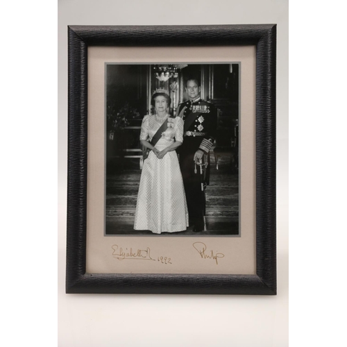 357 - Framed photograph of Prince Philip and Queen Elizabeth II, signed and dated 1992 to the mount, in Sm... 