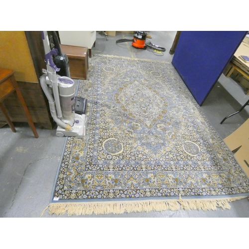 381 - Large blue and cream modern rug.