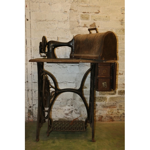 201 - Vintage Singer sewing machine on treadle base.