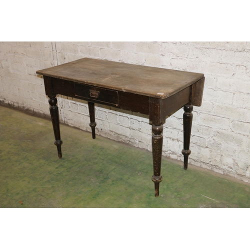 203 - Victorian painted pine side table with frieze drawer, raised on turned supports, 115cm long.