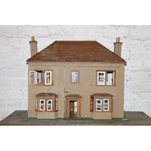 204 - Vintage two storey dolls house, with some fittings and furniture, 78cm long.