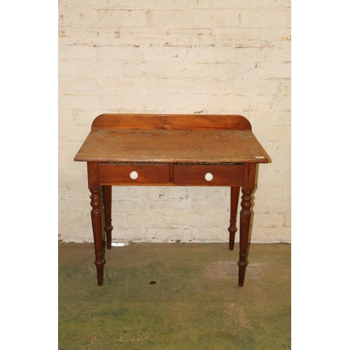 213 - Early 20th century pine side table with two frieze drawers, raised on turned supports, 91cm wide.