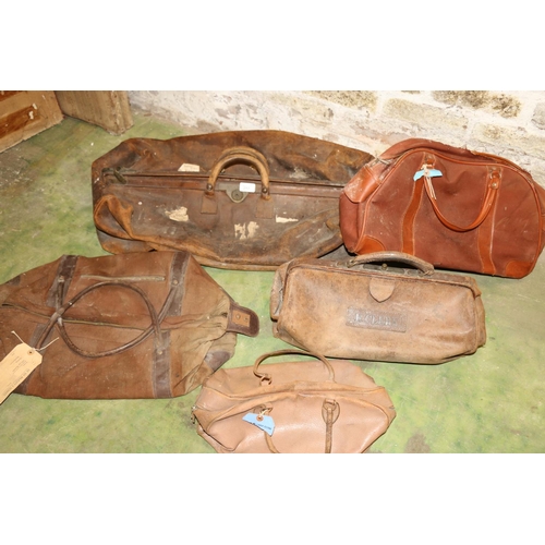 217 - Large vintage leather holdall, a similar Gladstone type bag, and others.