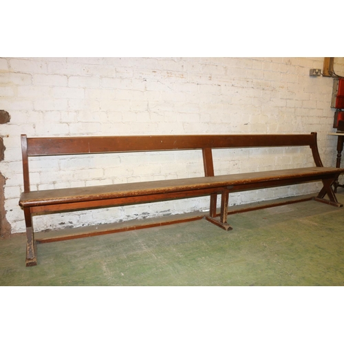 232 - Antique mahogany bench with X-form trestle end, 295cm long.