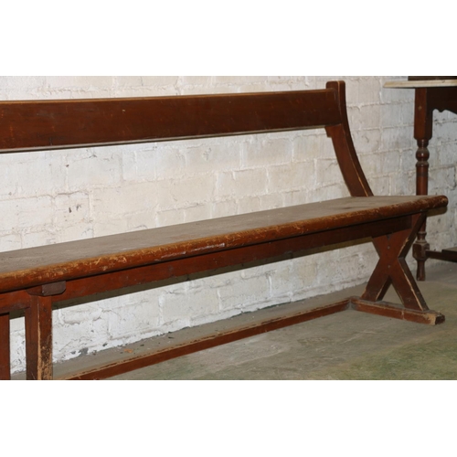 232 - Antique mahogany bench with X-form trestle end, 295cm long.