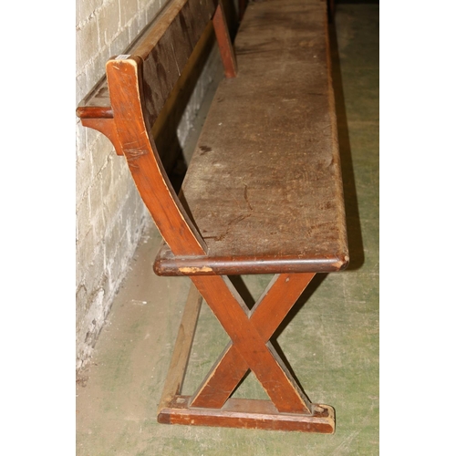 232 - Antique mahogany bench with X-form trestle end, 295cm long.