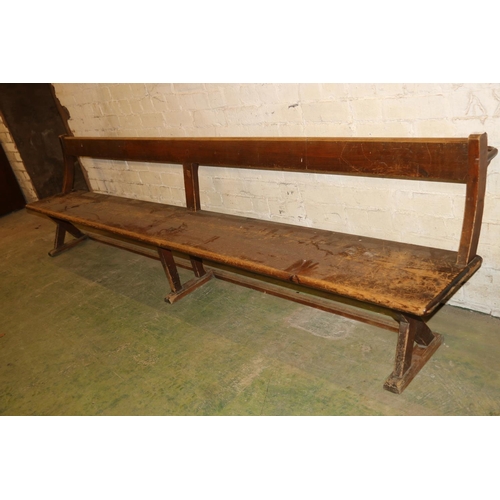 233 - Antique mahogany bench with X-form trestle end, 295cm long.