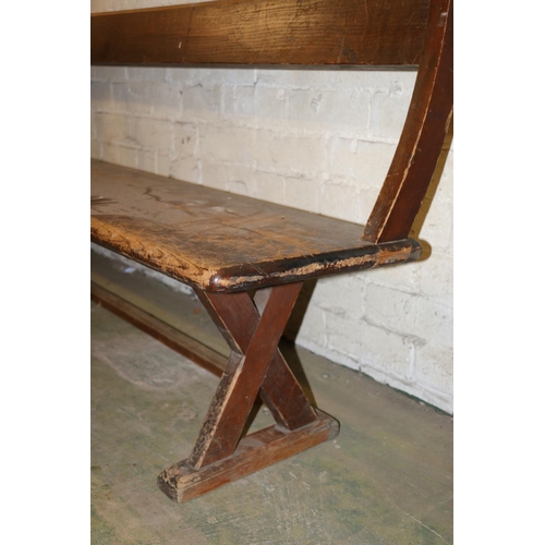 233 - Antique mahogany bench with X-form trestle end, 295cm long.