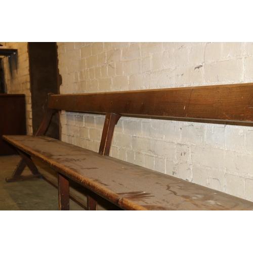 233 - Antique mahogany bench with X-form trestle end, 295cm long.