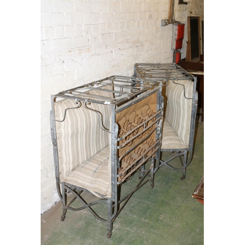 234 - Pair of white metal folding beds with sprung bases, raised on castors, 80cm wide.