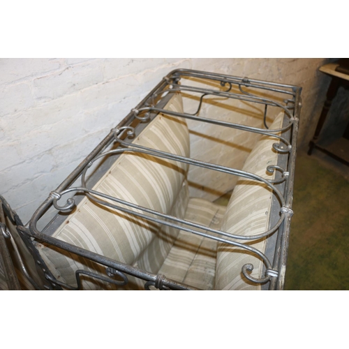 234 - Pair of white metal folding beds with sprung bases, raised on castors, 80cm wide.