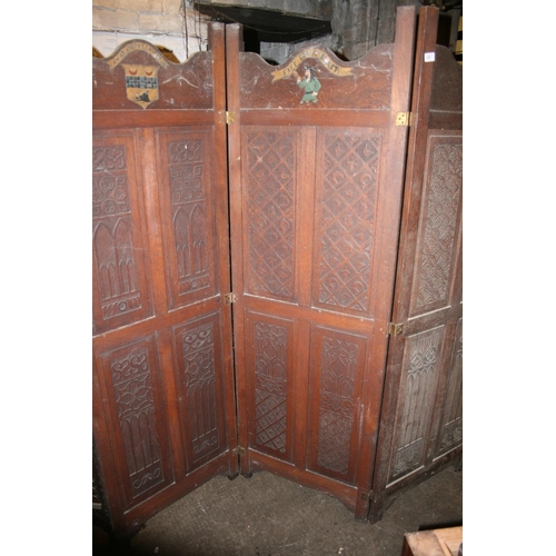 257 - Early 20th century carved oak three panel folding dressing screen, with carved pressed Amat Victoria... 