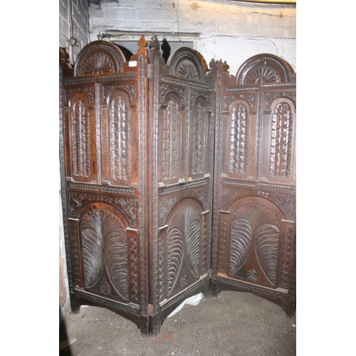 258 - Early 20th century carved oak three panel folding dressing screen, 155cm high.