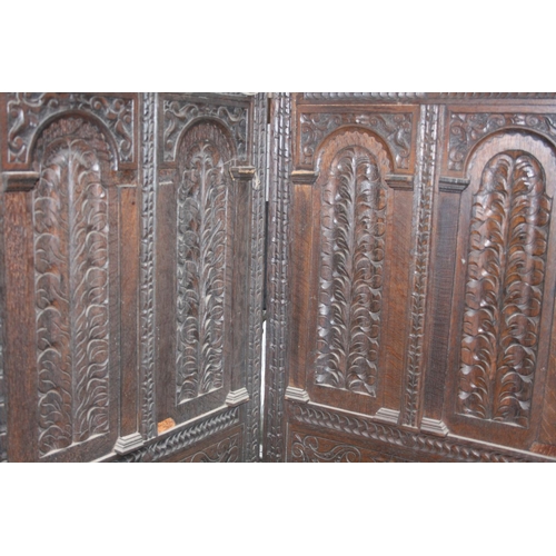 258 - Early 20th century carved oak three panel folding dressing screen, 155cm high.