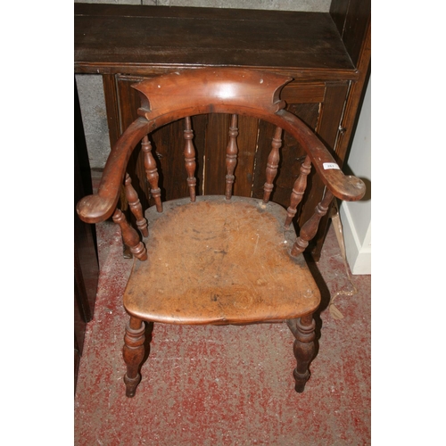 261 - Antique smokers bowl style chair with spindle back, saddle seat, raised on turned baluster supports.