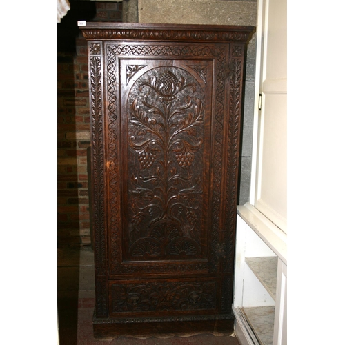 262 - Jacobean revival chip carved oak cupboard with panel door above base drawer, raised on plinth, 87cm ... 