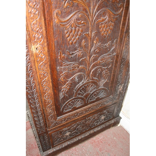 262 - Jacobean revival chip carved oak cupboard with panel door above base drawer, raised on plinth, 87cm ... 