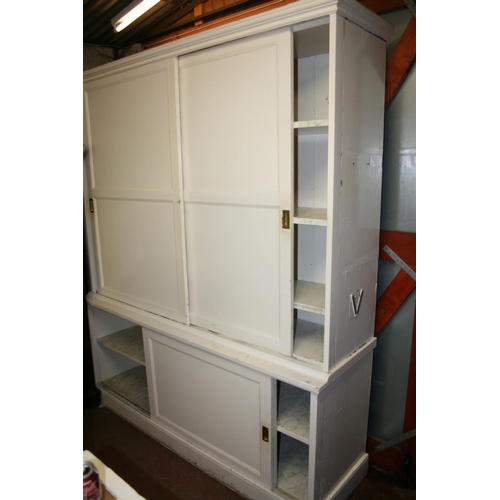 263 - Antique white painted sliding door cupboard with moulded cornice and plinth base, 186cm wide x 218cm... 