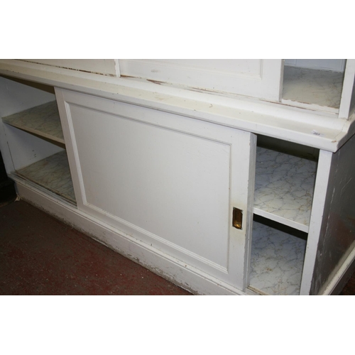 263 - Antique white painted sliding door cupboard with moulded cornice and plinth base, 186cm wide x 218cm... 