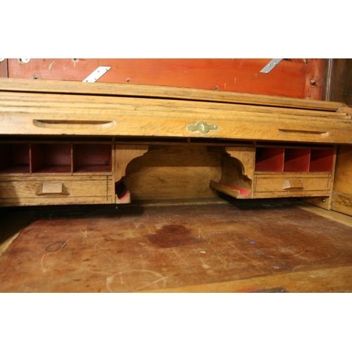 264 - Oak roll top desk with kneehole and pedestal of drawers, the tambour front opening to reveal fitted ... 