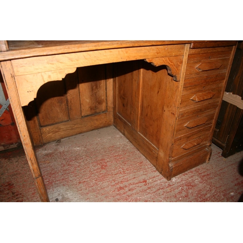 264 - Oak roll top desk with kneehole and pedestal of drawers, the tambour front opening to reveal fitted ... 