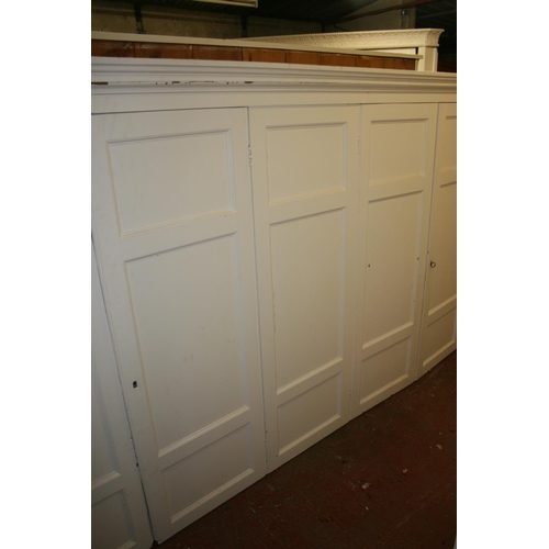 276 - Antique cream painted five door cupboard top with moulded cornice, on base, 284cm long x 253cm high.