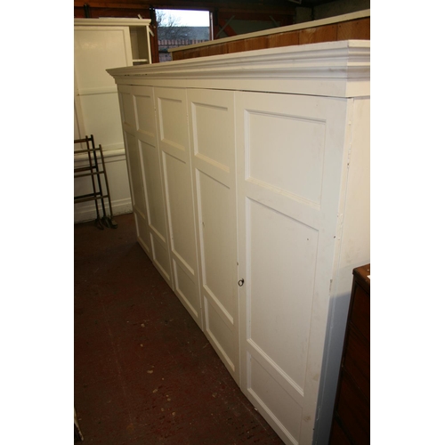 276 - Antique cream painted five door cupboard top with moulded cornice, on base, 284cm long x 253cm high.