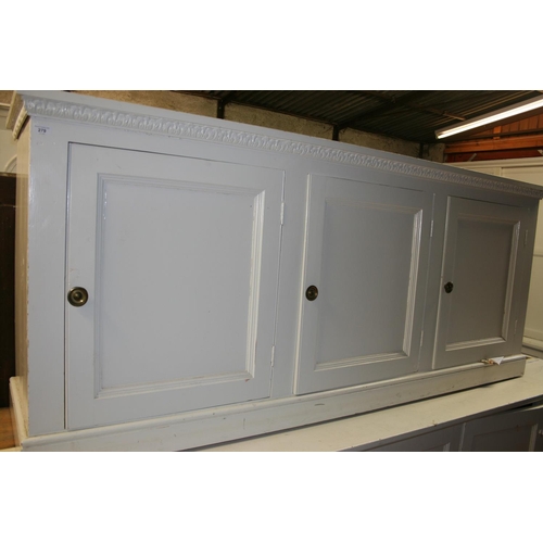 279 - Antique cream painted three door cupboard base, 223cm long.