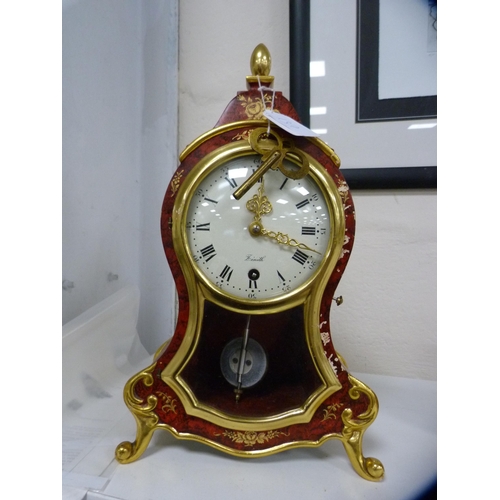 Zenith red lacquered pendulum clock with instructions.