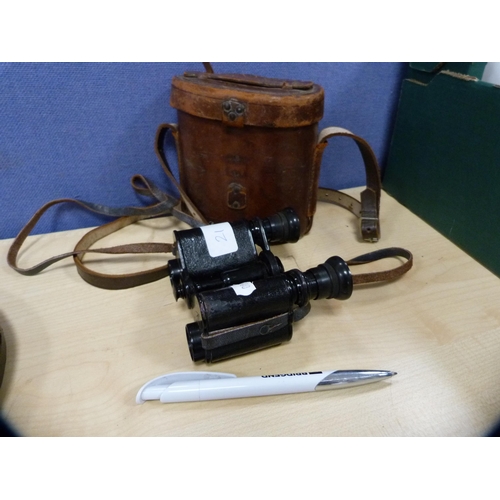 21 - Pair of military-issue field glasses with tooled leather case.