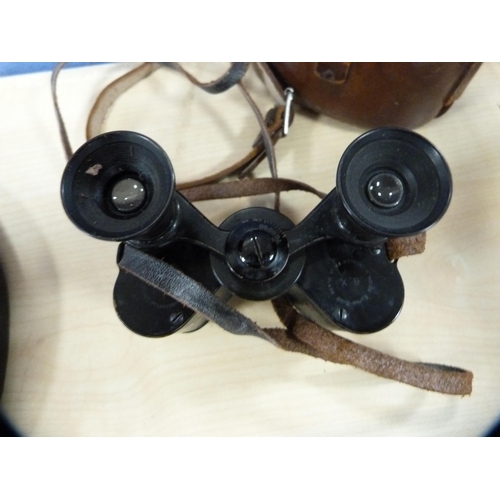 21 - Pair of military-issue field glasses with tooled leather case.