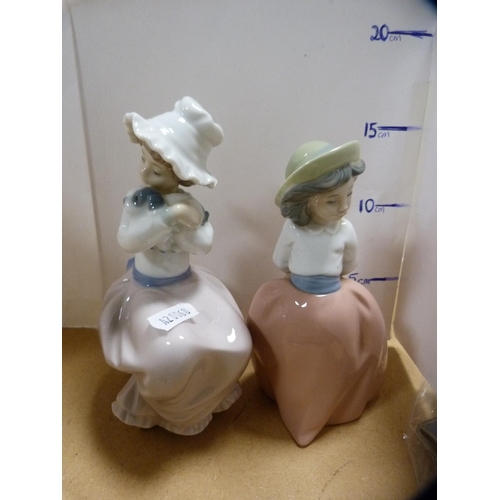 235 - Seven assorted Nao figures to include a pair wearing nightgowns.  (7)