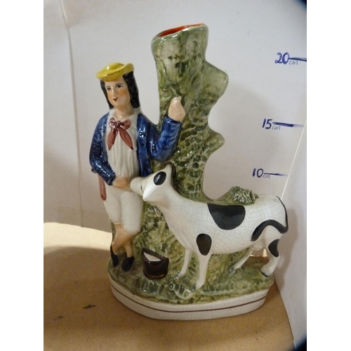 239 - Staffordshire posy vase modelled as a maiden and cow, and two Murano glass clown figures.  (3)