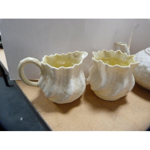 241 - Belleek teapot and a similar cream jug, early black backstamp for Fermanagh to the underside, simila... 