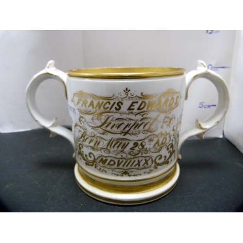 246 - Two Coalport-style ceramic loving cups with a gilt inscription, 'Francis Edwards, Liverpool'.