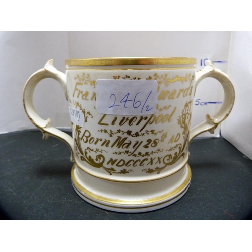 246 - Two Coalport-style ceramic loving cups with a gilt inscription, 'Francis Edwards, Liverpool'.