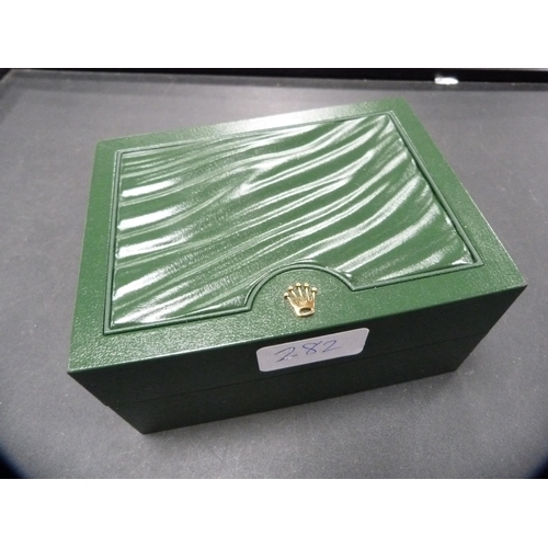 282 - Rolex green tooled watch box with gilt crown emblem to the top of the box, marked Rolex to the fitte... 