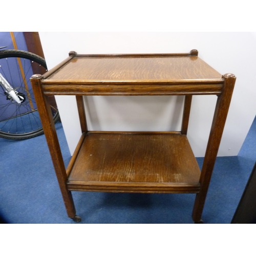 445 - Small mahogany open bookcase with two drawers above and an oak tea trolley.  (2)