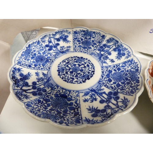 68 - Four Meiji period Japanese Imari dishes and a Japanese blue and white dish with frilly rim.  (5... 