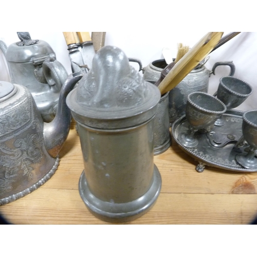 83 - Pewter and plated ware to include egg cruet, part tea sets, flatware etc.