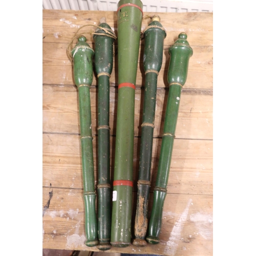 374 - Green painted metal sceptre case, 63cm long, and four green painted wooden batons, 55cm long.