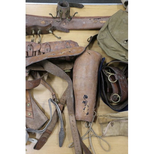 398 - Group of leather cartridge belts, cloth covered water bottle, Aldershot leather and brass coat stand... 