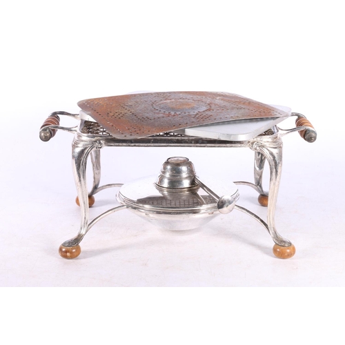 44A - White metal warming stand with burner, retailed by Harrods of London, 28cm across the handles.