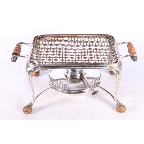 44A - White metal warming stand with burner, retailed by Harrods of London, 28cm across the handles.